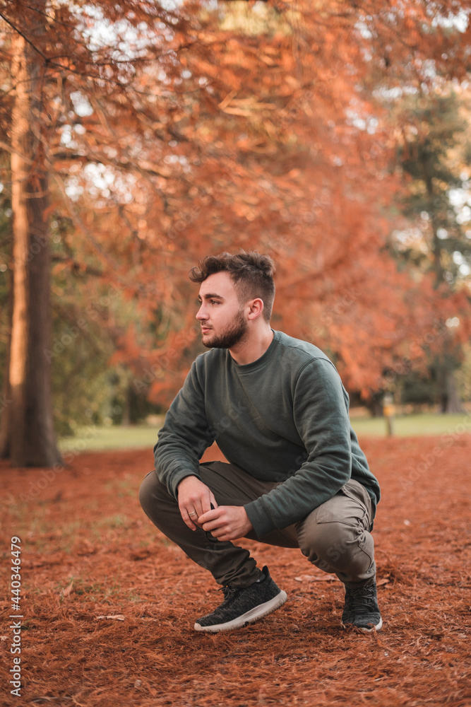 Portrait of a young handsome Caucasian man in a park Portrait of a young handsome Caucasian man in a park