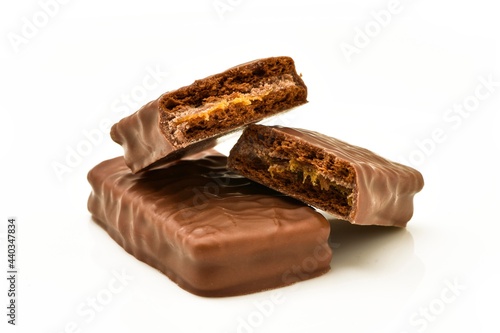 chocolate bar filled with caramel and biscuit  isolated on white background