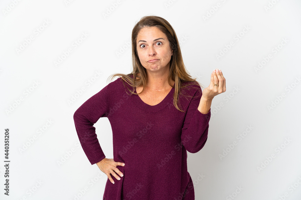 Middle age Brazilian woman isolated on white background making Italian gesture Middle age Brazilian woman isolated on white background making Italian gesture