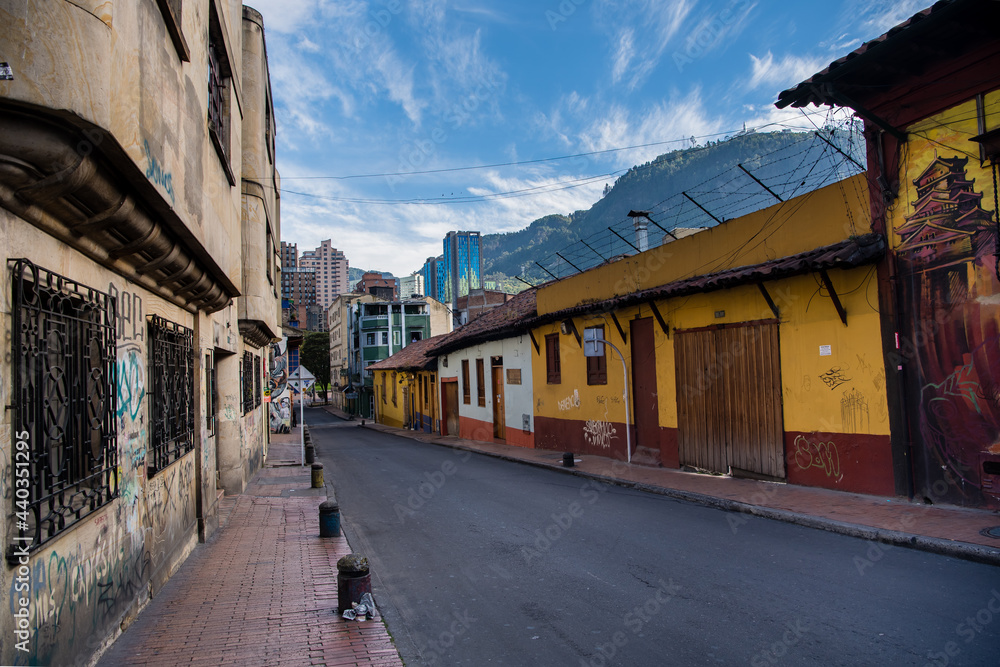View of graffiti homes in Bogota, Colombia. Wide angle street view.