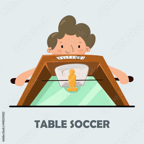 Table soccer. Poster for table football. The boy plays table football.