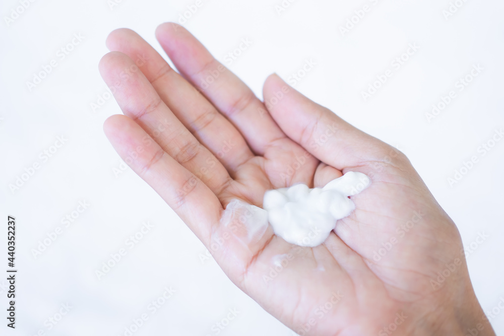 Lotion on hand palm up woman with white background. cream moisturizer cosmetic for skin care. lifestyle for good health concept. Lotion on hand palm up woman with white background. cream moisturizer cosmetic for skin care. lifestyle for good health concept.