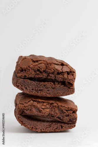 Delicious brownies stuffed with chocolate on white background. Copy space. photo