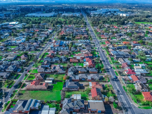 Panoramic aerial view of Melbournes western suburbs and CBD looking down at Houses roads and Parks Victoria 