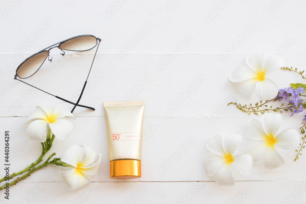 sunscreen spf50, sunglasses cosmetics for skin face of lifestyle woman relax arrangement flat lay style on background white wooden