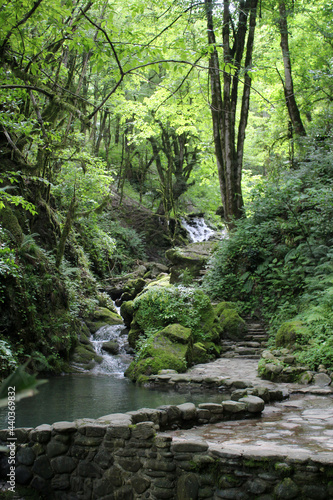 Waterfall in the mountains in the summer. Sochi, Russia.
