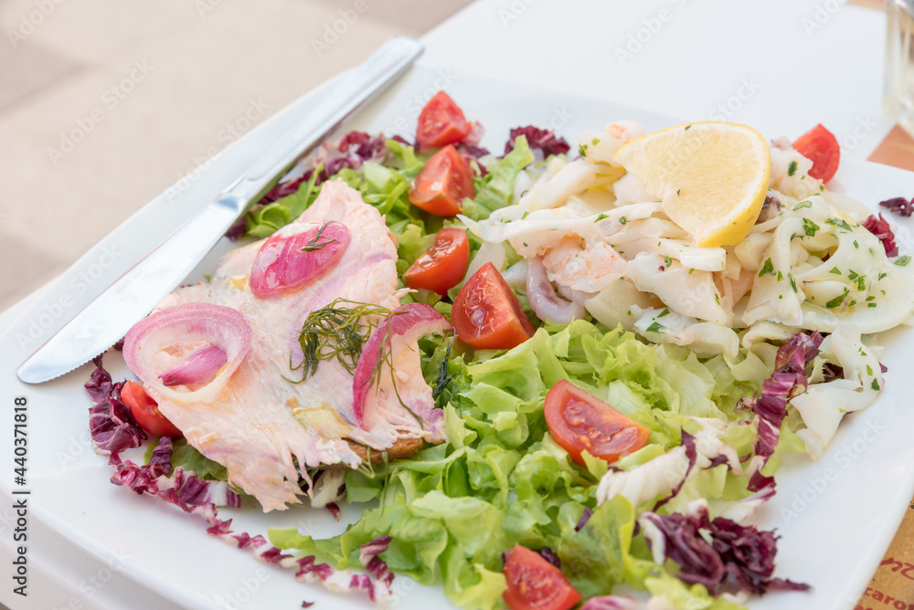 Seafood salad with salmon and vegetables Seafood salad with salmon and vegetables