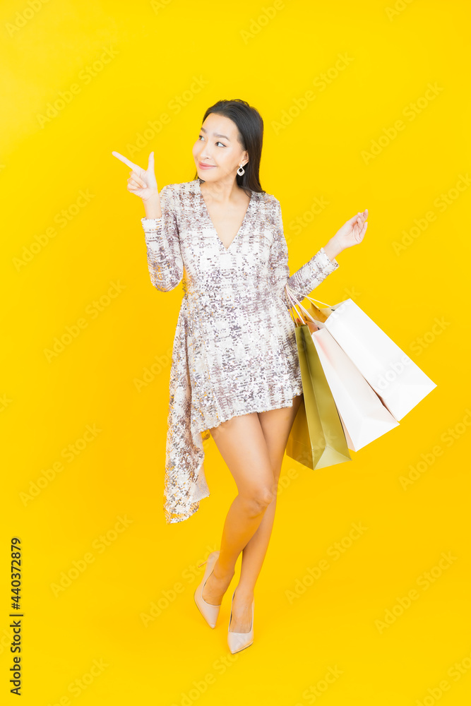 Portrait beautiful young asian woman smile with shopping bag Portrait beautiful young asian woman smile with shopping bag