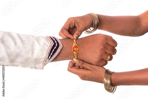 Fotografie Indian festival Raksha Bandhan, Raakhi on hand, Sister tie Rakhi as symbol of intense love for her brother