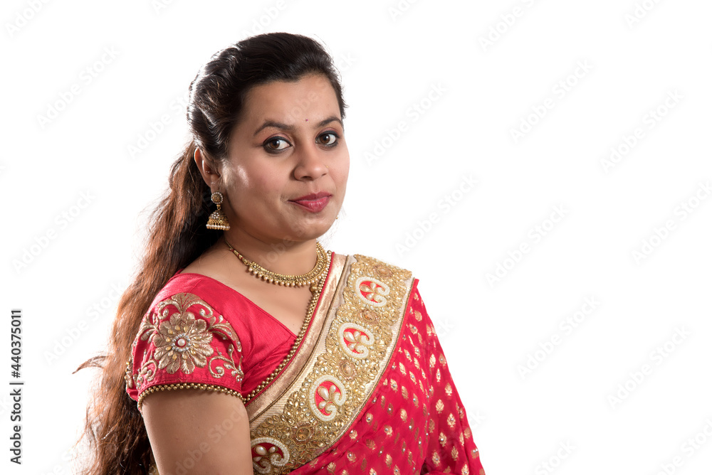 Beautiful young girl posing in Indian traditional saree on white background. Beautiful young girl posing in Indian traditional saree on white background.