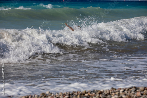 big waves with foam and sand near the shore, rescue, horizontal