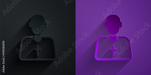 Paper cut Priest icon isolated on black on purple background. Paper art style. Vector