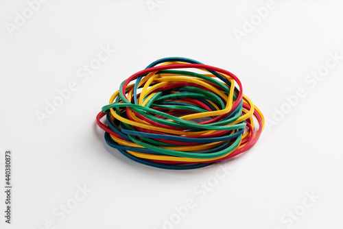 Heap of colored rubber bands on white background