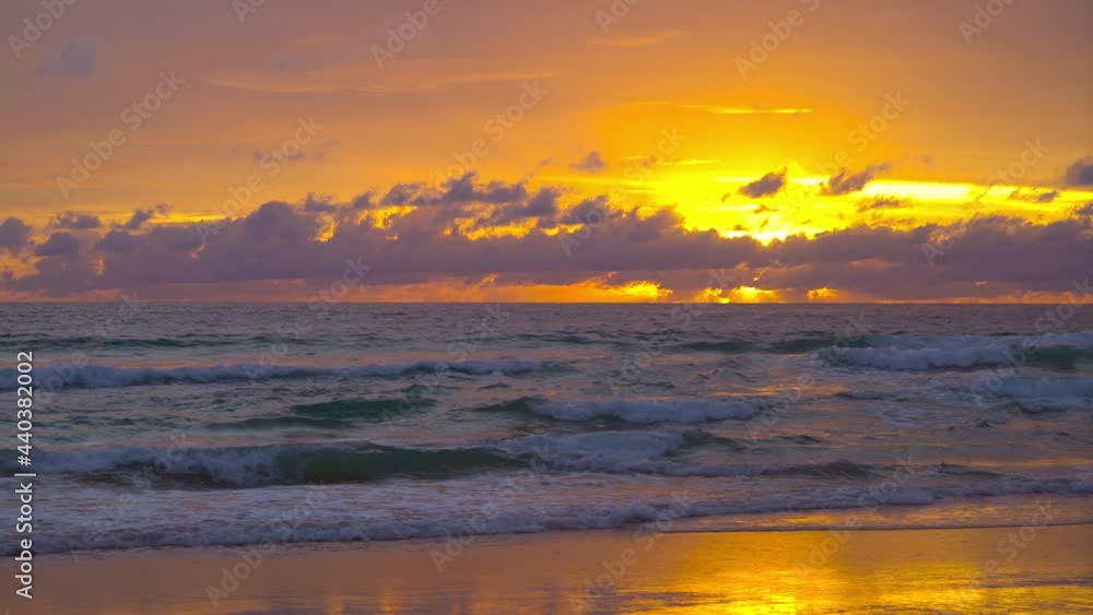 June 15, 2021. PHUKET THAILAND SEA BEACH. Dramatic sea sunset. Burning sky and shining golden waves. Amazing scene of Beautiful golden beach refection sunlight in sunset in the sea. June 15, 2021. PHUKET THAILAND SEA BEACH. Dramatic sea sunset. Burning sky and shining golden waves. Amazing scene of Beautiful golden beach refection sunlight in sunset in the sea.