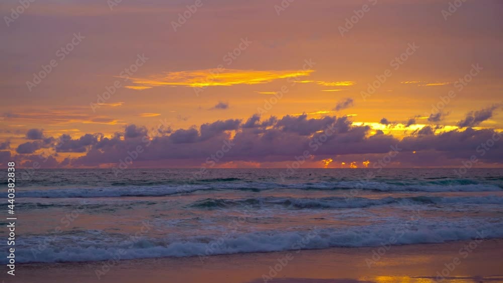 June 15, 2021. PHUKET THAILAND SEA BEACH. Dramatic sea sunset. Burning sky and shining golden waves. Amazing scene of Beautiful golden beach refection sunlight in sunset in the sea. June 15, 2021. PHUKET THAILAND SEA BEACH. Dramatic sea sunset. Burning sky and shining golden waves. Amazing scene of Beautiful golden beach refection sunlight in sunset in the sea.