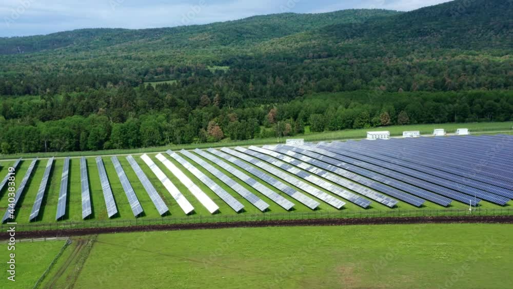 Photovoltaic modules convert solar radiation. A power plant against a backdrop of beautiful nature. Forest and hills. The concept of energy supply to villages and farms. High quality. 4k footage. Photovoltaic modules convert solar radiation. A power plant against a backdrop of beautiful nature. Forest and hills. The concept of energy supply to villages and farms. High quality. 4k footage.