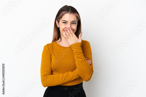Young caucasian woman isolated on white background happy and smiling covering mouth with hand