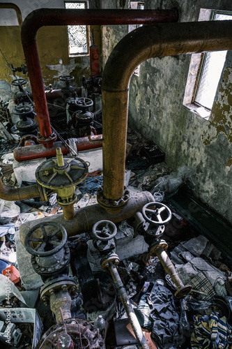 Fototapeta Naklejka Na Ścianę i Meble -  abandoned industrial area with pipes and taps