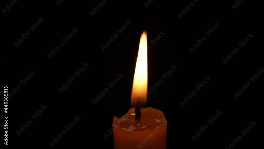 Candle is lit by lighter on black background, Close up Candle Flame Candle is lit by lighter on black background, Close up Candle Flame