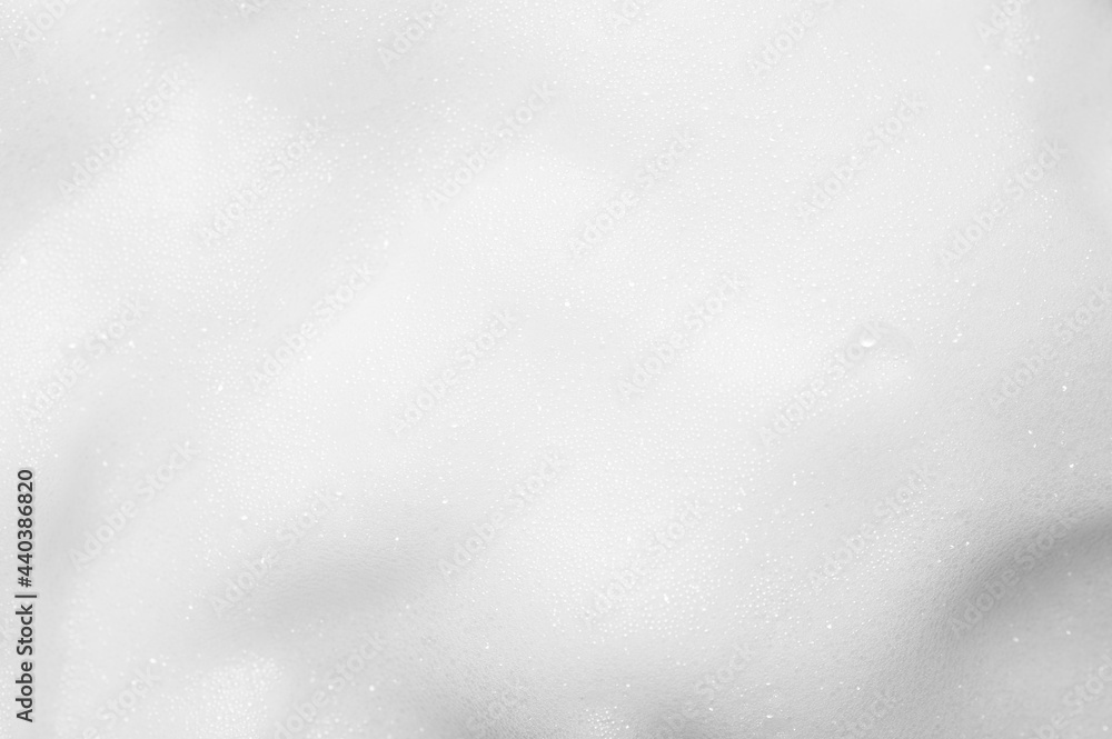 Obraz premium White foam texture close up background. Soapy substance with bubbles backdrop. Creamy shampoo surface. Shower gel, washing liquid smears wallpaper. Cosmetic product foamy smudges
