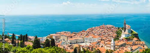 A panoramic of old town Piran, Slovenia. View over the tiled roofs of Piran and the Adriatic Sea.
