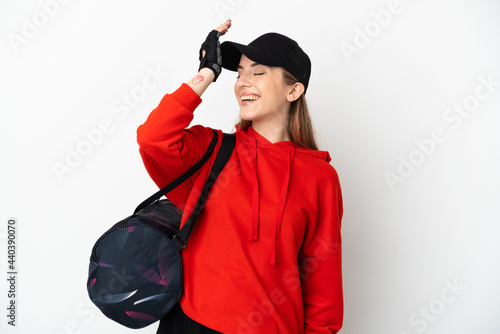 Young sport woman with sport bag isolated on white background has realized something and intending the solution