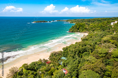 Tropical Island Aerial View. Wild coastline lush exotic green jungle. Red Frog Beach in Bastimentos Island, Bocas del Toro, Central America, Panama.