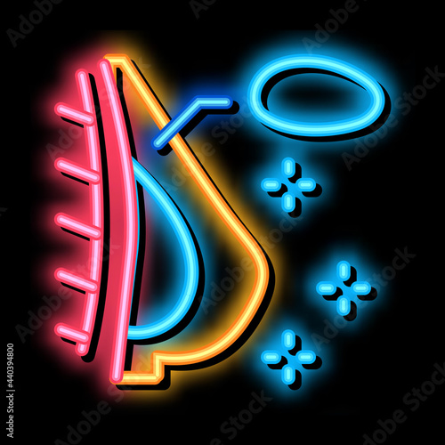silicone breast augmentation neon light sign vector. Glowing bright icon silicone breast augmentation sign. transparent symbol illustration