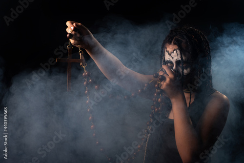 Voodoo queen, portrait of a supernatural entity Voodoo queen, artistic makeup, black background, Low Key portrait, selective focus. © Milton Buzon
