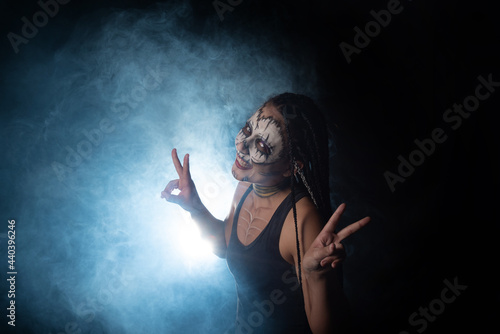 Voodoo queen, portrait of a supernatural entity Voodoo queen, artistic makeup, black background, Low Key portrait, selective focus.