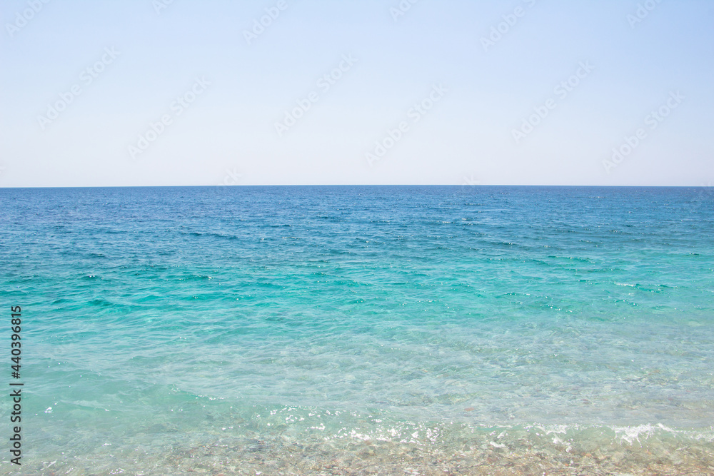 Blue sea. Beautiful view of the sea water and the sky, with various shades of blue.