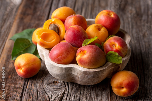 Fresh apricot fruit on the wooden background