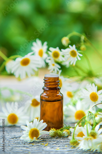 Essential oil extract of medicinal chamomile. Selective focus.