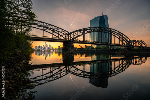 Sunset in Frankfurt am Main. Skyline wedged under a steel bridge. Right on the banks of the river Main and at the ECB in Frankfurt photo