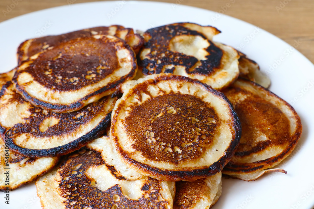 A plate of freshly baked homemade pancakes for breakfast. A plate of freshly baked homemade pancakes for breakfast.