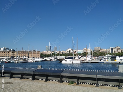 Boats anchored by the harbour in summer