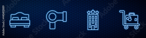 Set line Hotel building, room bed, Hair dryer and Suitcase. Glowing neon icon on brick wall. Vector