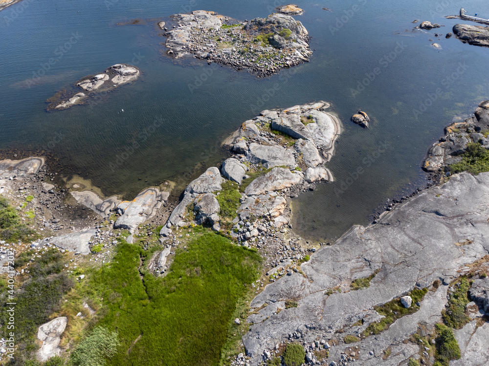 Bird's eye view of archipelago, coastline, cliffs and sea. Aerial, drone photography from above, northern Gothenburg in Sweden. Place for text, copy space.