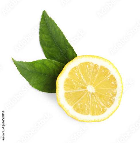 Fresh ripe lemon half with leaves on white background  top view