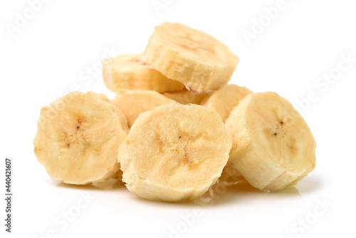 Heap of banana slices on a white background