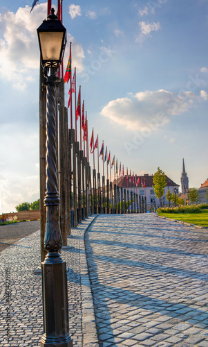 A row with various historical Hungarian flags near the Karmelita monastery in Budapest - Hungary photo