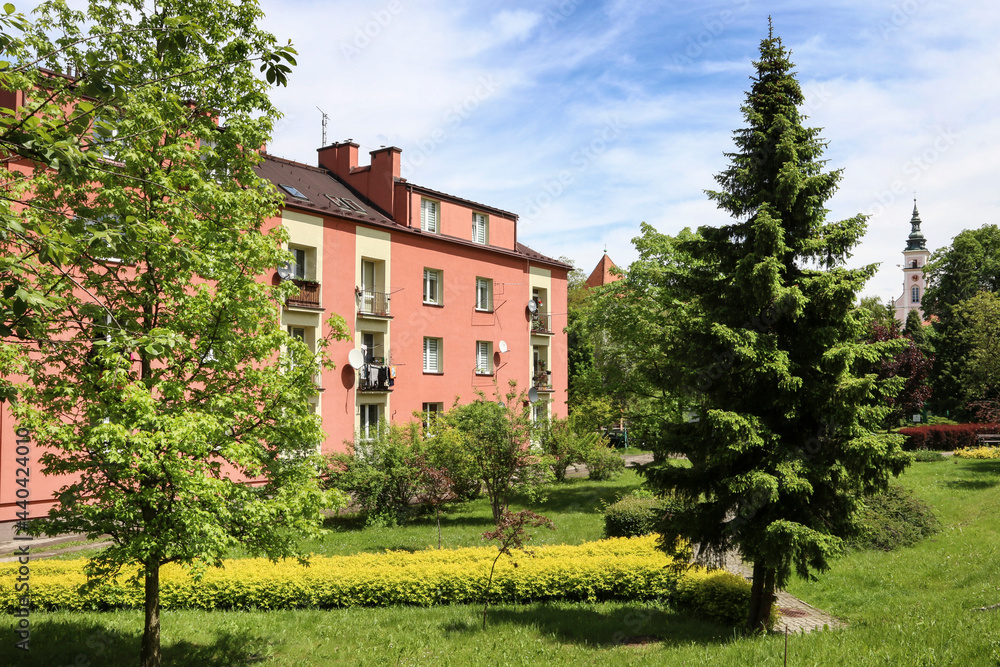 WIELICZKA, POLAND - MAY 26, 2021: A multi-family residential building surrounded by a park WIELICZKA, POLAND - MAY 26, 2021: A multi-family residential building surrounded by a park