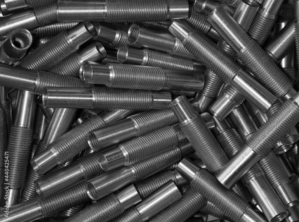 Many iron threaded fittings for connecting metal water pipes or high pressure polymer pipes. Background, texture. Industrial equipment. Many iron threaded fittings for connecting metal water pipes or high pressure polymer pipes. Background, texture. Industrial equipment.