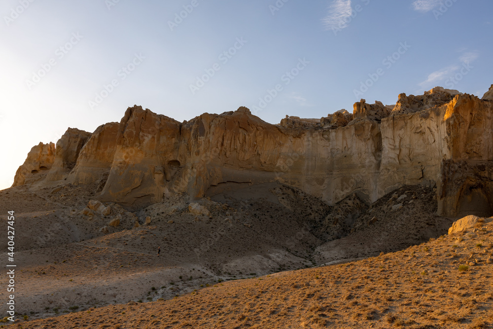 The north-east side of Sherkala mountain just after sunrise. Mangystau Province, western Kazakhstan, close to the town of Shetpe. The north-east side of Sherkala mountain just after sunrise. Mangystau Province, western Kazakhstan, close to the town of Shetpe.