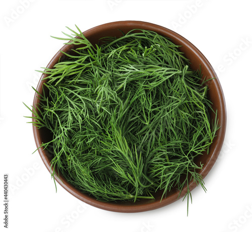 Fresh dill in bowl isolated on white, top view
