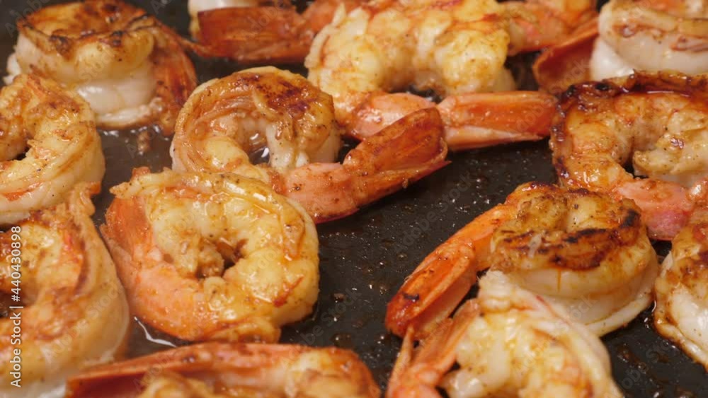 Cooking langoustine on frying pan. Fried shrimps. Closeup Cooking langoustine on frying pan. Fried shrimps. Closeup