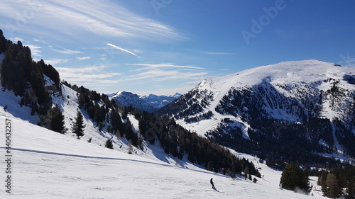 Panoramic View of Ski Slope And The Sky in Ski Centre Latemar. Italy. Dolomite Alps. Dolomiti Superski. Mountains. Great Fun. Holiday Destination. Ski Industry. Well Prepared Slopes. Tourism. photo