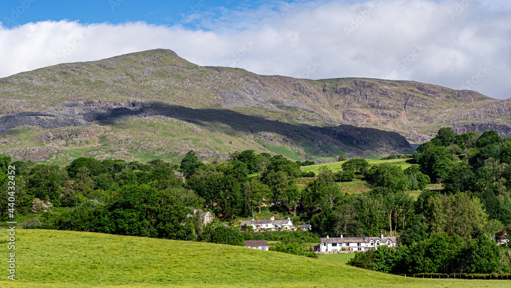 Early morning light on the village of Coniston & the 'Old Man' towering over the village