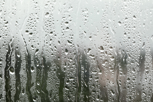 Window glass with raindrops as background  closeup