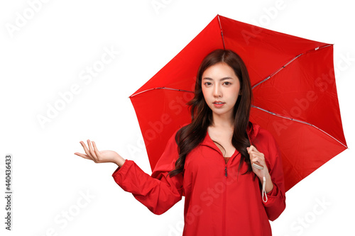 Asian woman cover herself with rain clothes and umbrella, Isolate white background